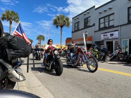 a group of people riding motorcycles down the street at Holiday Inn Hotel & Suites Daytona Beach On The Ocean by IHG in Daytona Beach