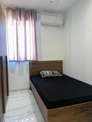 Cama o camas de una habitación en MAPAS - luxury 3 bedroom Apartments