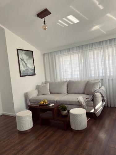 a living room with a couch and a table at Stan Maric in Široki Brijeg