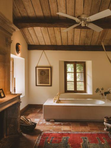 a large room with a large bed in a room at Les Prés d'Eugénie in Eugénie-les-Bains