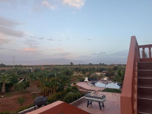 a view from the balcony of a house with a pool at chez JM saida in Ourika