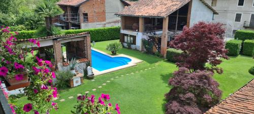an aerial view of a yard with a swimming pool at L'Oasi Bed and Breakfast di Franco e Paola in San Martino Canavese