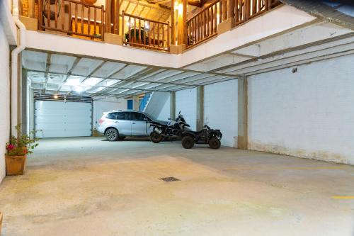 a parking garage with a motorcycle parked in it at Hotel Boutique Casa Encanto Barichara in Barichara