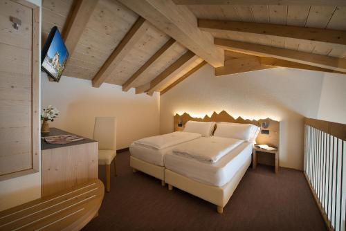 Llit o llits en una habitació de Hotel Silvestri