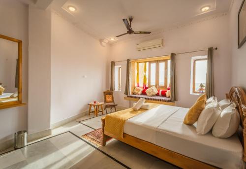 a bedroom with a large bed in a room at Golden Vista Guest House in Jaisalmer