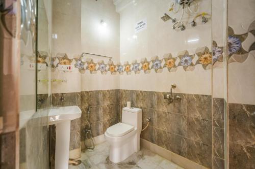 a bathroom with a toilet and a sink at Golden Vista Guest House in Jaisalmer