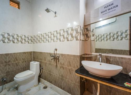 a bathroom with a white toilet and a sink at Golden Vista Guest House in Jaisalmer
