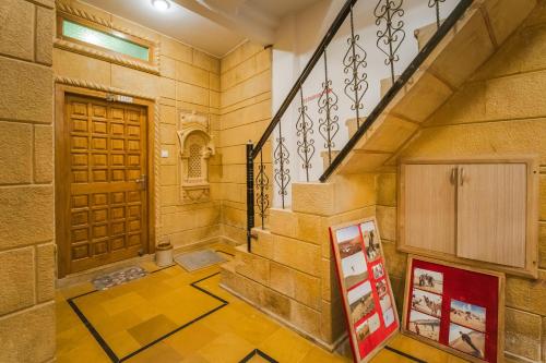 a staircase in a building with a door and a sign at Golden Vista Guest House in Jaisalmer