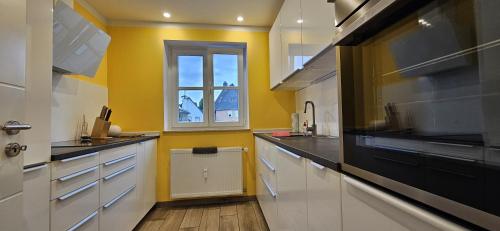 Η κουζίνα ή μικρή κουζίνα στο Ferienwohnung Seulberg 1 OG