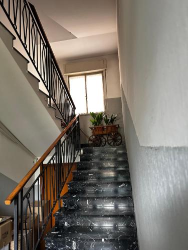 a staircase in a building with a window at Residenza Dei Parchi in Sondrio