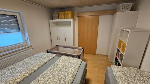 Postel nebo postele na pokoji v ubytování Ferienwohnung Torkar Velden