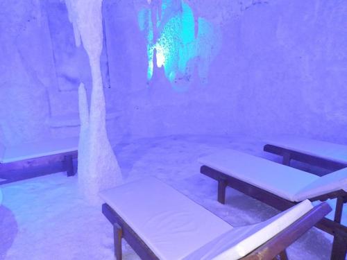 a room with three benches in a room with lights at Graf Victor Apart Hotel in Alanya