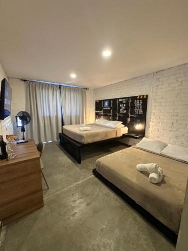 Letto o letti in una camera di Eco Hotel La Colina Mirador Con aire acondicionado