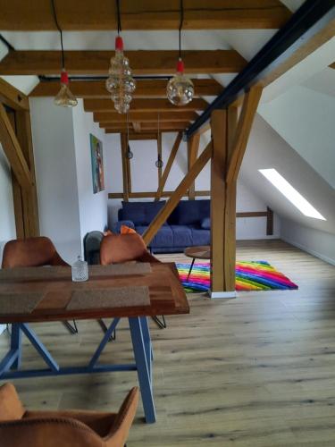 a man laying on a table in a living room at A7 J22 FeWo Michelangelo NETFLIX Fußgängerzone in Eisenach