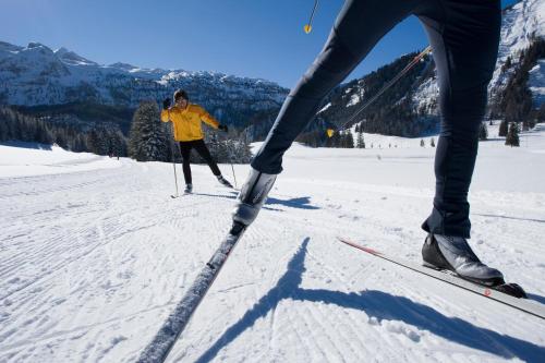 a person on skis in the snow on a ski slope at Hotel Zehnerkar & Hotel Obertauern in Obertauern