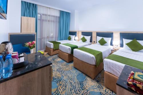 Katil atau katil-katil dalam bilik di Hayah Al Waha Hotel