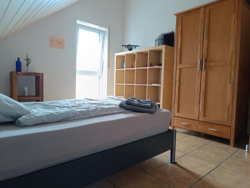 Postel nebo postele na pokoji v ubytování Ferienwohnung Mainzelmännchen