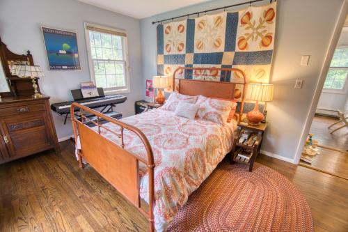 a bedroom with a bed and a dresser and a desk at Catskills Getaway 3BR Retreat with Media Room, Near Casino, Bethel Woods and More in Glen Wild