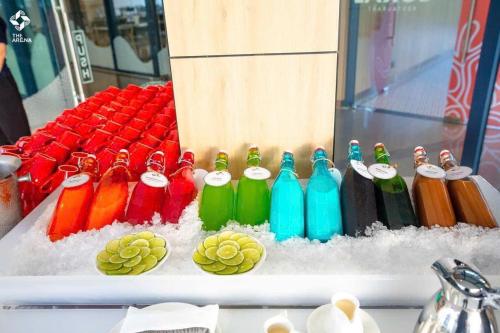 a group of different colored bottles sitting in snow at Luxury Beach Resort - Arena Cam Ranh in Cam Ranh International Airport