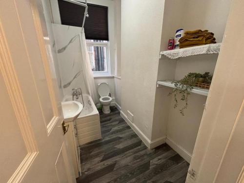 a small bathroom with a sink and a toilet at Amazing Studio in London-L in Harrow Weald