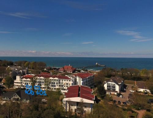 a view of a city with houses and the ocean at ZingstUrlauber in Zingst