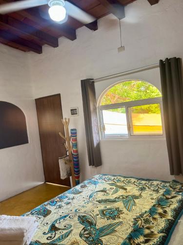 a bedroom with a bed and a window at Refugio del Cielo # in Sayulita