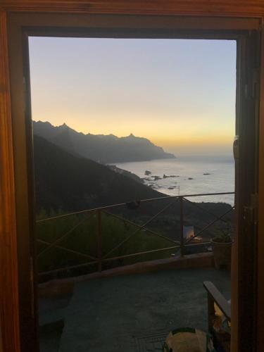 a view of the ocean from a window at Casa Amarilla de Playa Benijo in Almáciga