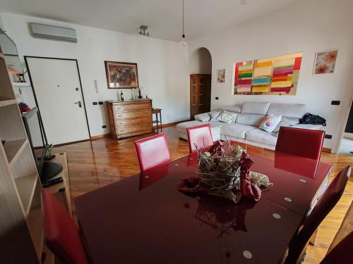 a living room with a table and a couch at Casa Guarducci in Prato