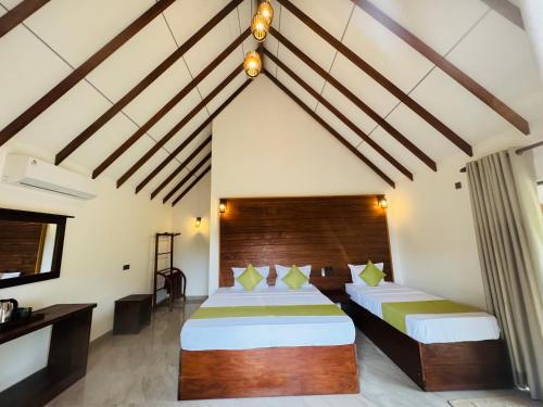 Postel nebo postele na pokoji v ubytování Sungreen Cottage Sigiriya