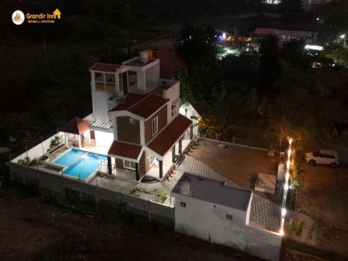an aerial view of a house at night at Grandir Inn Villa in Mahabalipuram