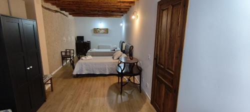 Кровать или кровати в номере Casa Rural Casona Camino Pedraza - 4 Estrellas