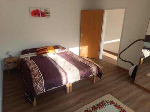 Ένα ή περισσότερα κρεβάτια σε δωμάτιο στο Wohnung auf dem Bezenberg