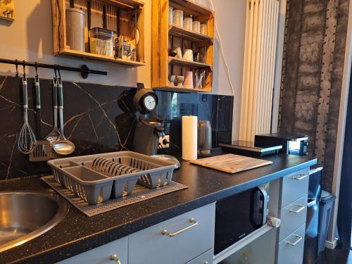 a kitchen counter with a tray of dishes on it at Fewo RELAX in Borken