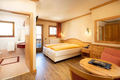 Кровать или кровати в номере Hotel La Pastorella