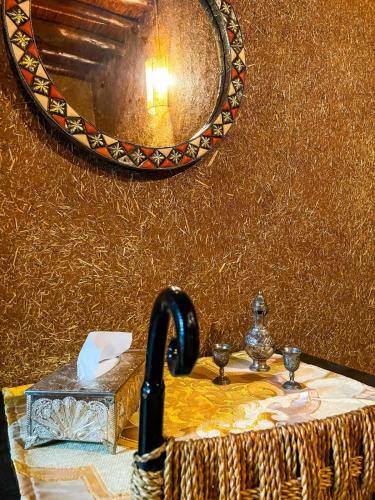 a bathroom with a sink and a mirror at FERME D'HOTES BARGHALi in Marrakech