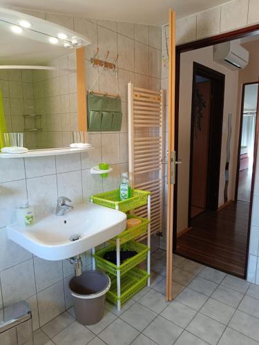 a bathroom with a sink and a mirror at Apartment Viškovo in Viskovo