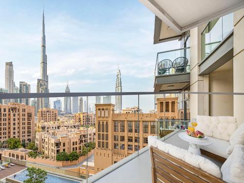a balcony with a view of the city at Wake Up to Burj Khalifa l Modern New 1BR Apartment in the Heart of Downtown Dubai in Dubai