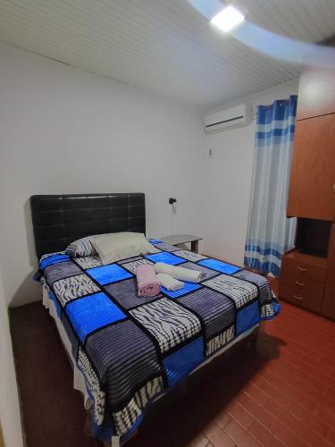 a bedroom with a bed in a room at Departamento por dia in Posadas