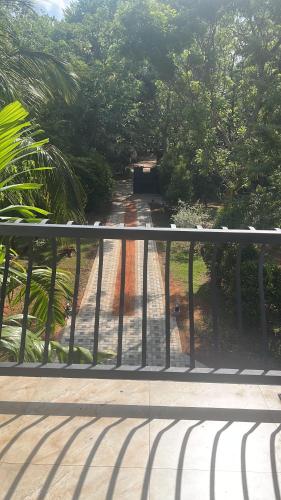 a view of a walkway from a balcony at Mashi's Villa in Sigiriya