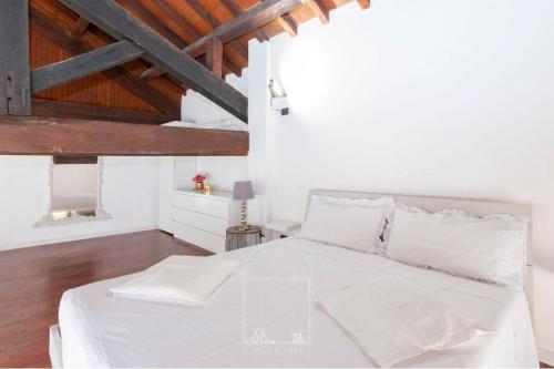 Ένα ή περισσότερα κρεβάτια σε δωμάτιο στο Casa Emma un'esperienza suggestiva