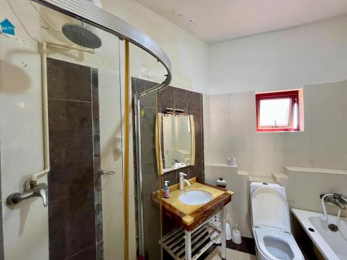 a bathroom with a sink and a shower at Seabreeze apartments in Mombasa