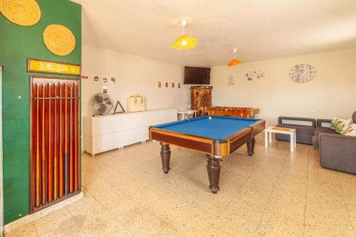 a living room with a pool table in it at 4Ever Palace Design&Nature in Alcácer do Sal