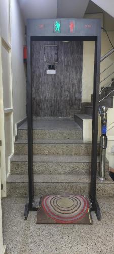 a set of stairs in a building with a water fountain at Hotel Airport View at Delhi Airport by Global Group in New Delhi