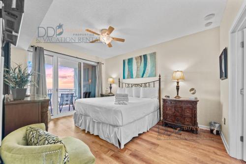 a bedroom with a bed and a ceiling fan at Legacy Tower II 403 in Gulfport