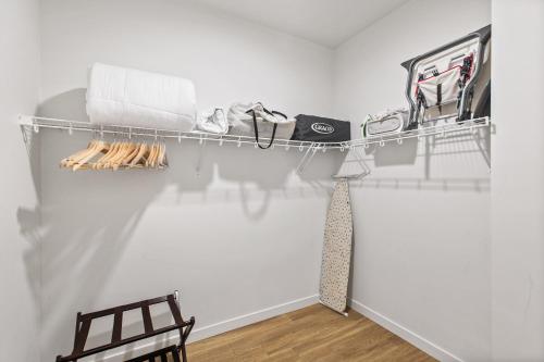 a closet with a tie hanging on a wall at Airy and Open Corner Loft - 92 Walkscore in Redmond