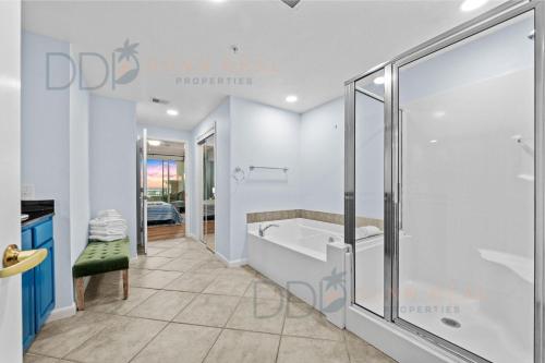 a bathroom with a tub and a shower at Legacy Tower I 304 in Gulfport