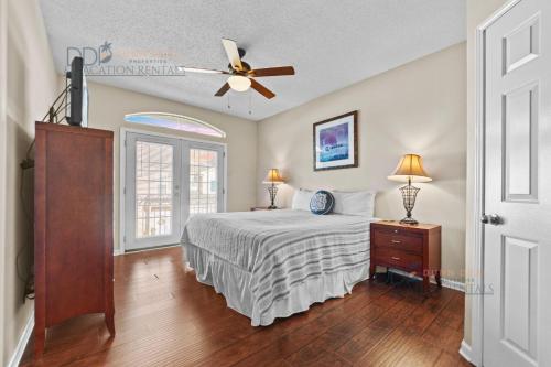 a bedroom with a bed and a ceiling fan at Legacy Villa 1504 in Gulfport