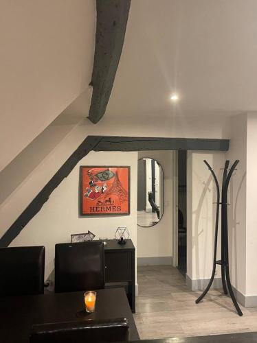 a living room with a couch and a table at Appartement refait à neuf en centre ville in Bonneuil-sur-Marne