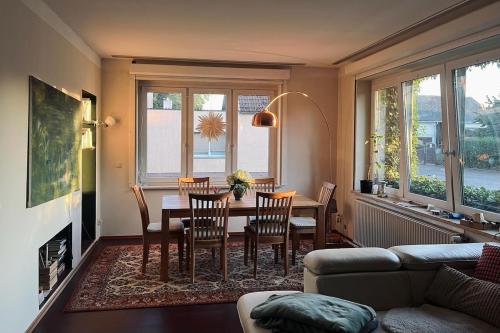 a living room with a table and chairs at Landhaus Kloster Marienfließ in Stepenitz