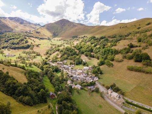 an aerial view of a small village in the mountains at Magnifique chalet à 3km PEYRAGUDES PYRENEES LUCHON in Gouaux-de-Larboust